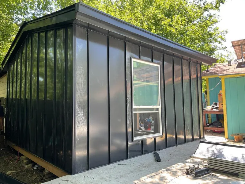 Black standing seam metal wall panels for Roof Inspection in Destin